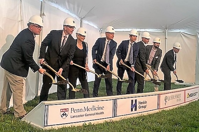 Groundbreaking participants with shovels